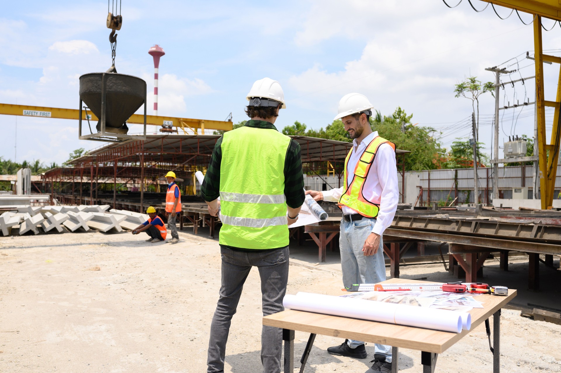 Two civil and construction engineers are working precisely according to the plans to ensure a flawless result.